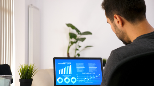 Business Person Working His Laptop Looking Chart Data His Living Room